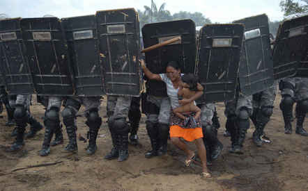 Woman tries to stop forced eviction of her people, Manaus, Brazil, March 10 (Winner World Press Photo of the Year, General News, Luis Vasconcelos, A Critica - Zuma Press, 2008)